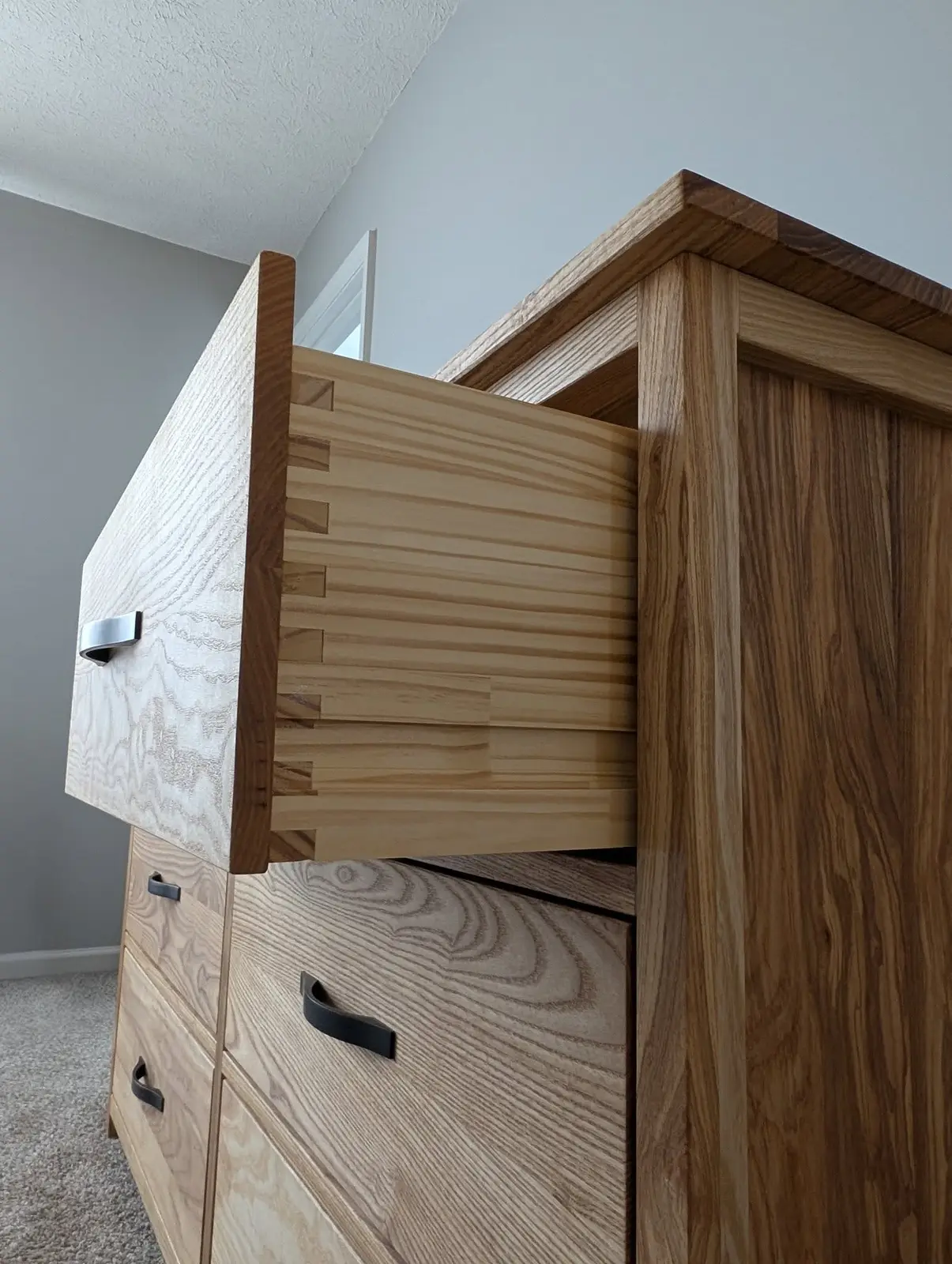 Open drawer showing box-jointed corners on the solid pine drawer box